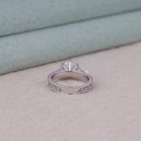 Silver ring with intricate design on a light gray surface, Art Deco Round Moissanite Ring, Vintage Filigree Solitaire Engagement Jewelry