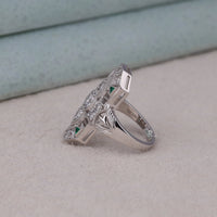 Silver ring with gemstones on a light gray surface, Victorian Era Fashion Ring, Green and Clear CZ Ring, Art Deco Geometric Cocktail Ring