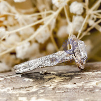 Double Halo Round Cut Moissanite Twisted Shank Engagement Ring In Two Tone Gold