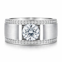 Silver ring with a large central diamond and smaller diamonds along the band on a white background