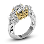 Elegant ring with a central diamond and gold accents on a white background, Round Moissanite Black Eye Owl Inspire Three Stone Ring, Owl Inspired Moissanite Engagement Ring, Black and White Moissanite Three Stone Ring, Unique Owl Design Engagement Ring, Symbolic Three Stone Moissanite Wedding Ring