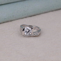 Silver ring with a large diamond on a light gray surface, Conflict Free Moissanite Ring, Elegant Moissanite Engagement Band, Moissanite Proposal Ring, Fine Moissanite Jewelry for Women