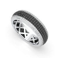 Silver ring with black and white gemstones on a white background