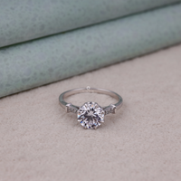 Silver ring with a large diamond on a textured surface, moissanite diamond alternative ring, moissanite proposal ring for her, moissanite seven stone gold ring