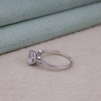 Silver ring with a diamond on a beige surface, moissanite seven stone silver ring, moissanite luxury engagement ring, moissanite jewelry for wedding