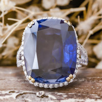 Halo Split Shank Ring With Blue Cushion Cut CZ