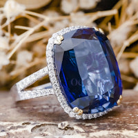 Halo Split Shank Ring With Blue Cushion Cut CZ