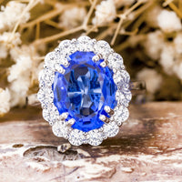 Royal Blue Sapphire Oval Cut With Round White CZ Stone Floral Motif Halo Engagement Ring