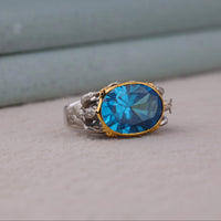 Ring with a blue gemstone and gold accents on a neutral background, Aqua-Man Poseidon Mascot Cocktail Ring, Ocean Inspired Statement Jewelry, Superhero Comic Fan Ring, Bold Poseidon Greek God Jewelry