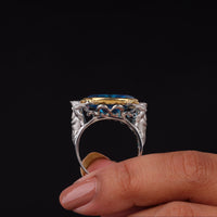 Silver ring with blue gemstones held by a hand against a black background, Luxury Poseidon Mascot Party Wear Ring, Trendy Comic Book Character Jewelry Gift