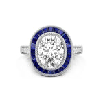 Diamond ring with blue gemstones on a white background
