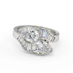 Diamond ring with a heart-shaped design on a white background