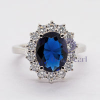 Blue Oval-Cut CZ Wedding Ring With Sunburst Halo