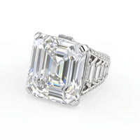Diamond ring with a large emerald-cut diamond on a white background