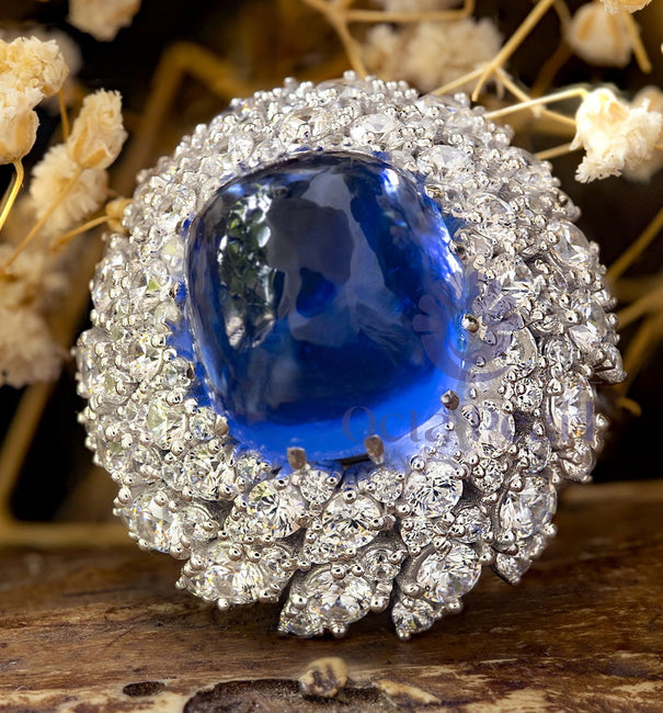 Blue Cabochon Cocktail Ring With CZ Halo