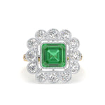 Ring with a green gemstone and diamond-studded halo on a white background