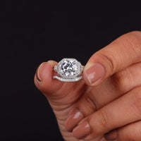 Diamond ring held in a hand against a black background, Affordable Moissanite Wedding Ring Set, Conflict Free Moissanite Engagement Jewelry
