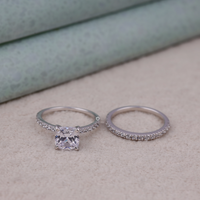 Two silver rings with gemstones on a neutral background, Elegant Moissanite Wedding Set, Eco Friendly Moissanite Bridal Jewelry, Sustainable Cushion Cut Moissanite Set