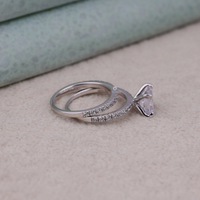 Silver ring with a diamond on a beige surface, Lab Created Moissanite Bridal Jewelry, Bridal Engagement Set With Cushion Center Stone,