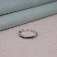 Silver ring with small stones on a beige surface, Bold Two Color Moissanite Wedding Ring, Affordable Black White Moissanite Bridal Band,