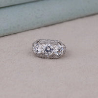Silver ring with two large diamonds on a light gray surface, art deco engagement ring with three stones, cubic zirconia art deco ring for her, bridal CZ three stone vintage style ring