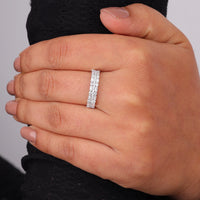 Hand wearing a silver ring on a plain background, Moissanite Anniversary Band, 14K Gold Moissanite Band Ring, Elegant Moissanite Wedding Ring