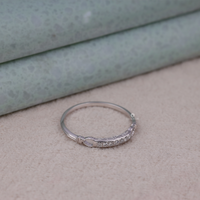 Silver ring with small stones on a textured surface, Round Moissanite Seven Stone Ring, Edwardian Style Moissanite Band, Vintage Moissanite Band Ring, Seven Stone Moissanite Band, Moissanite Anniversary Ring