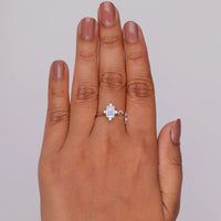 Silver ring with a blue gemstone on a hand against a gray background, Five Stone Moonstone Promise Ring, Rainbow Moonstone And White CZ Anniversary Ring, Timeless Moonstone Engagement Ring For Bride