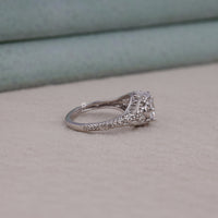 Silver ring with diamond on a light gray surface