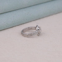 Silver ring with a diamond on a light beige surface, Vintage Inspired Halo Moissanite Bridal Jewelry, Classic Cushion Moissanite Engagement Wedding Set,