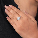 Close-up of a hand wearing a diamond ring on a blurred background, Double Halo Split Shank Cushion Moissanite Ring, Cushion Cut Moissanite Engagement Ring, Split Shank Bridal Ring
