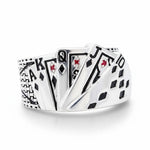 Silver ring with playing card suits design on a white background