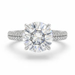 Diamond ring with a large central gemstone on a white background