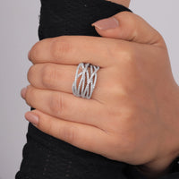 Hand wearing a silver ring with a textured design on a gray background, Unique Criss Cross Bridal Band, 14K Gold Moissanite Party Ring, Dainty Moissanite Engagement Band, Fashionable Moissanite Stacking Jewelry