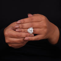 Heart-shaped diamond ring on a hand against a black background, Heart Cut Moissanite and Round Moissanite Halo Engagement Ring