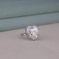 Heart-shaped diamond ring on a soft surface with a blurred background, Sustainable Conflict Free Moissanite Engagement Ring, Romantic Gift Ring For Anniversary Or Proposal