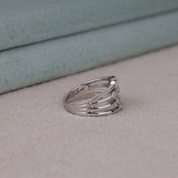 Silver ring with a diamond on a light gray surface, Contemporary Round Moissanite Multi Layer Ring – Bubble Bezel Wedding Jewelry