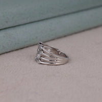 Silver ring with diamonds on a light gray surface, Round Moissanite Multi Row Bezel Ring – Bubble Design Modern Bridal Band