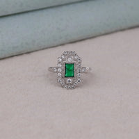 Silver ring with a green gemstone on a light gray surface, Timeless Vintage Style Wedding Band, Eco Friendly Art Deco Bridal Ring, Antique Inspired Green CZ Wedding Ring