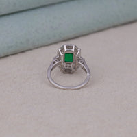 Silver ring with a green gemstone on a light gray surface, Fashionable Vintage Style Promise Ring, Sparkling Green Cubic Zirconia Bridal Ring, Affordable Art Deco Wedding Jewelry