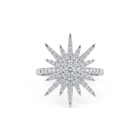 Diamond ring with starburst design on a white background