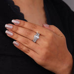 Hand wearing a diamond ring with glittery nail polish on a dark background, Milgrain Art Deco Vintage Bridal Ring Set – Marquise & Round Moissanite Wedding Ring