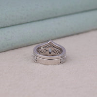 Silver ring with intricate design on a light background, Vintage Milgrain Marquise & Round Moissanite Bridal Set – Art Deco Engagement Ring