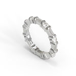 Silver ring with diamonds on a white background, Round & Baguette Moissanite Dot Dash Eternity Band