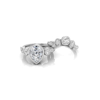 Diamond ring with a heart-shaped center stone on a white background, Bezel Set Pear And Round Cut CZ Stone Wedding Ring Set For Women