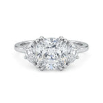 Cushion cut cubic zirconia three stone engagement ring with half moon side stones in a classic prong setting