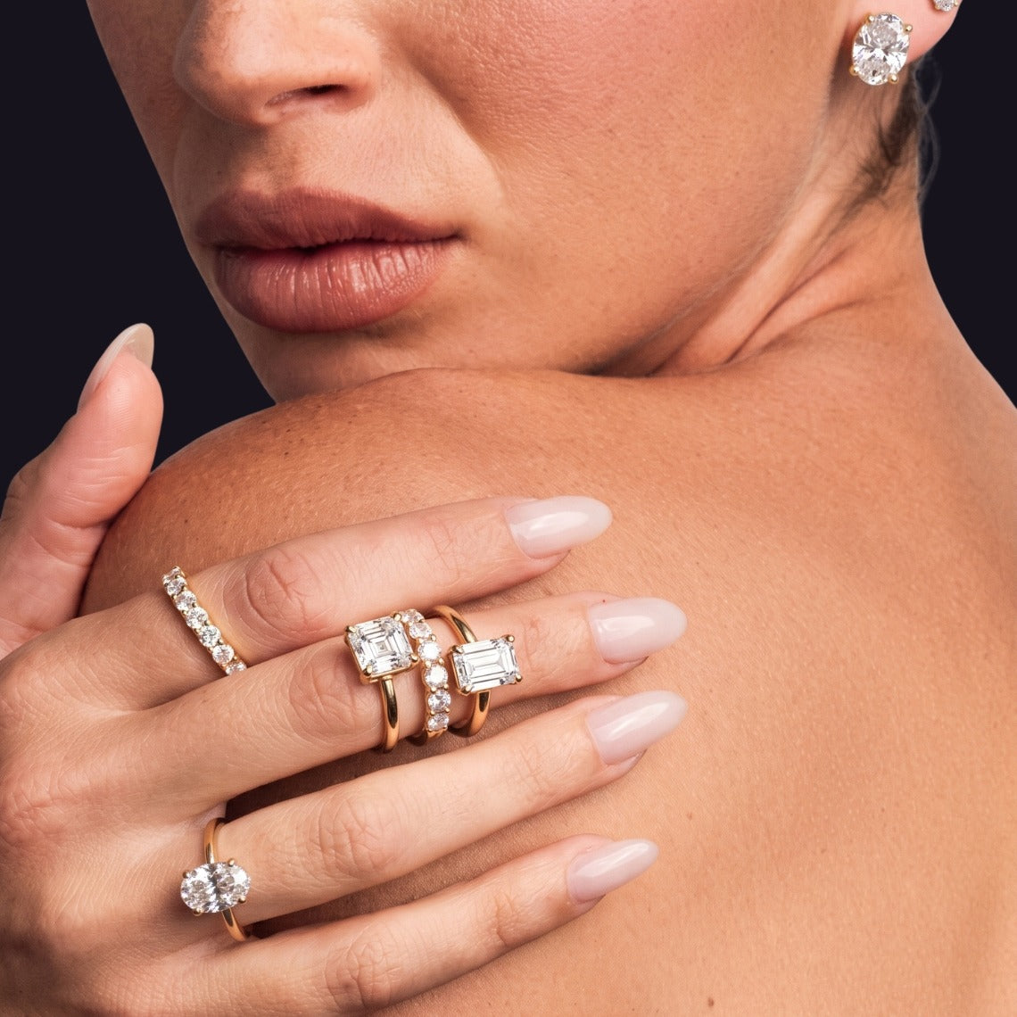 Emerald-cut lab-grown diamond engagement ring on black
