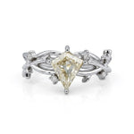 Nature-inspired vine ring featuring a kite cut cubic zirconia center stone with round accent stones and botanical leaf detailing