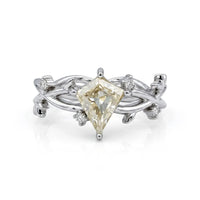 Nature-inspired vine ring featuring a kite cut cubic zirconia center stone with round accent stones and botanical leaf detailing