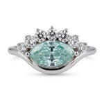 Ocean Bloom marquise cut aqua blue moissanite crown ring with round accent stones in a nature-inspired wave design